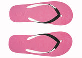 Pair of pink flip-flops with black straps on a white background