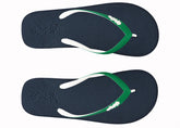 Pair of navy blue flip-flops with green straps on a white background