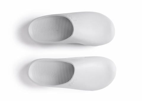 Pair of white slippers on a white background