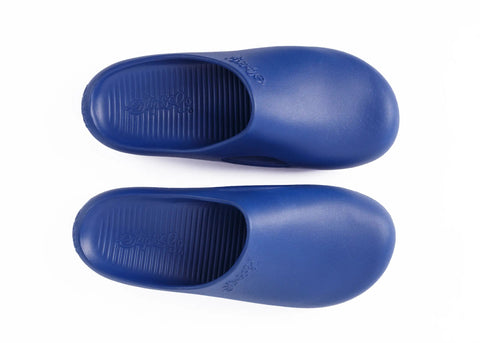 Pair of blue slippers on a white background