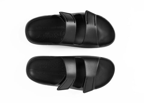 Pair of black sandals on a white background