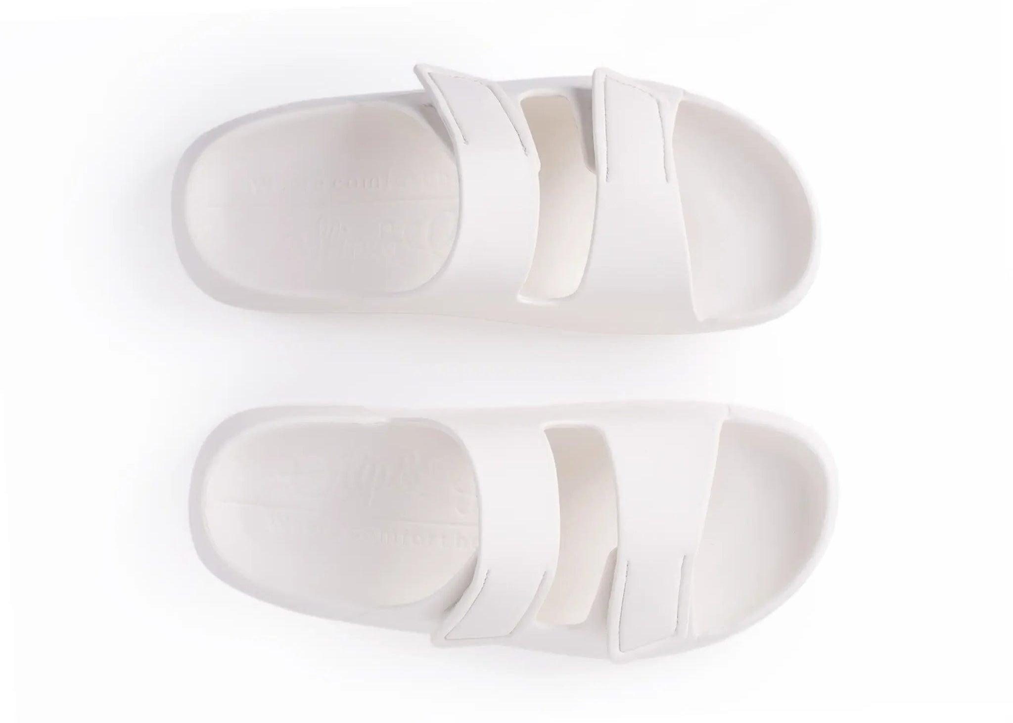 Pair of white slippers on a white background