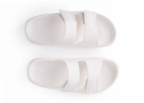 Pair of white slippers on a white background