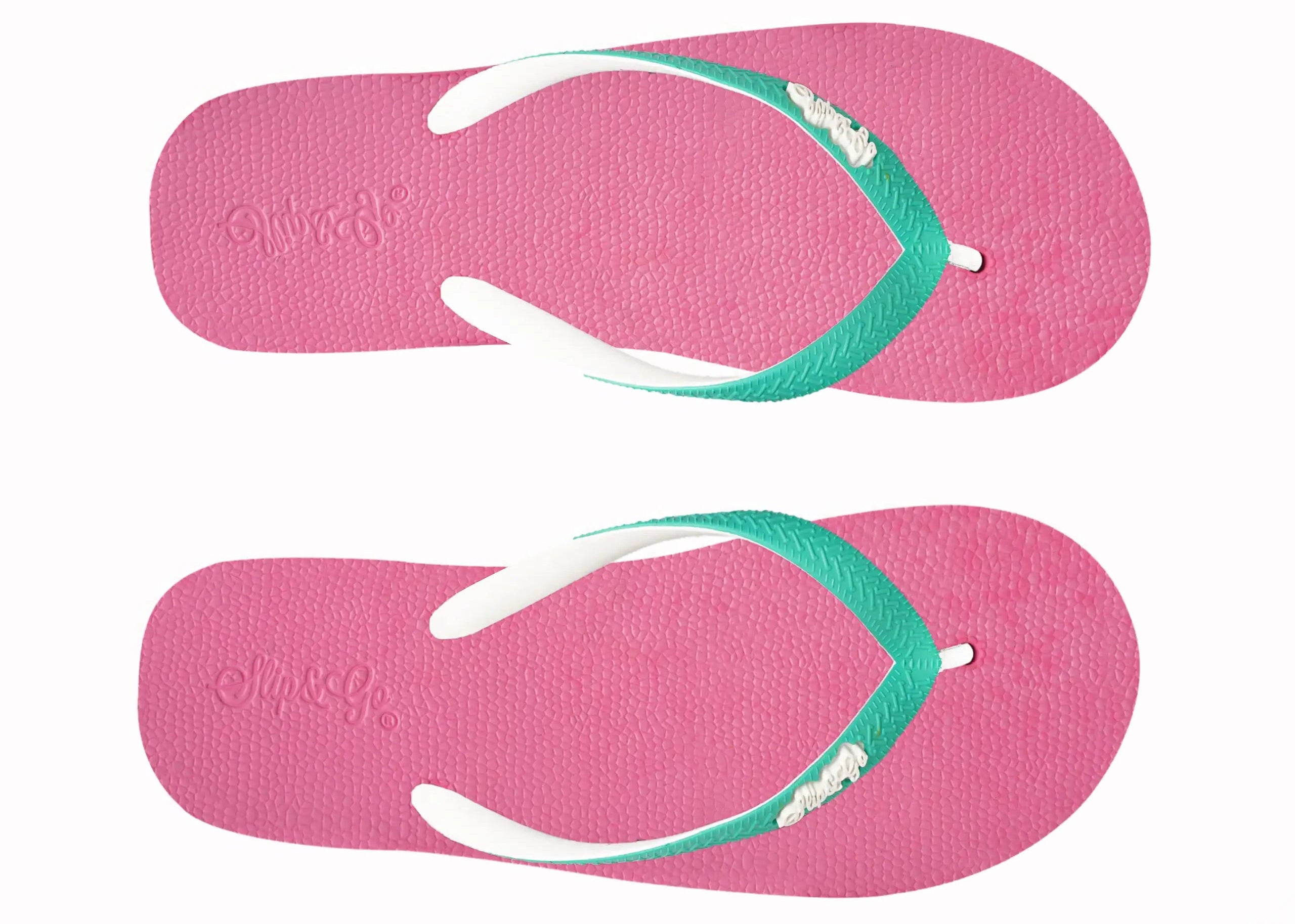 Pair of pink flip-flops with green straps on a white background