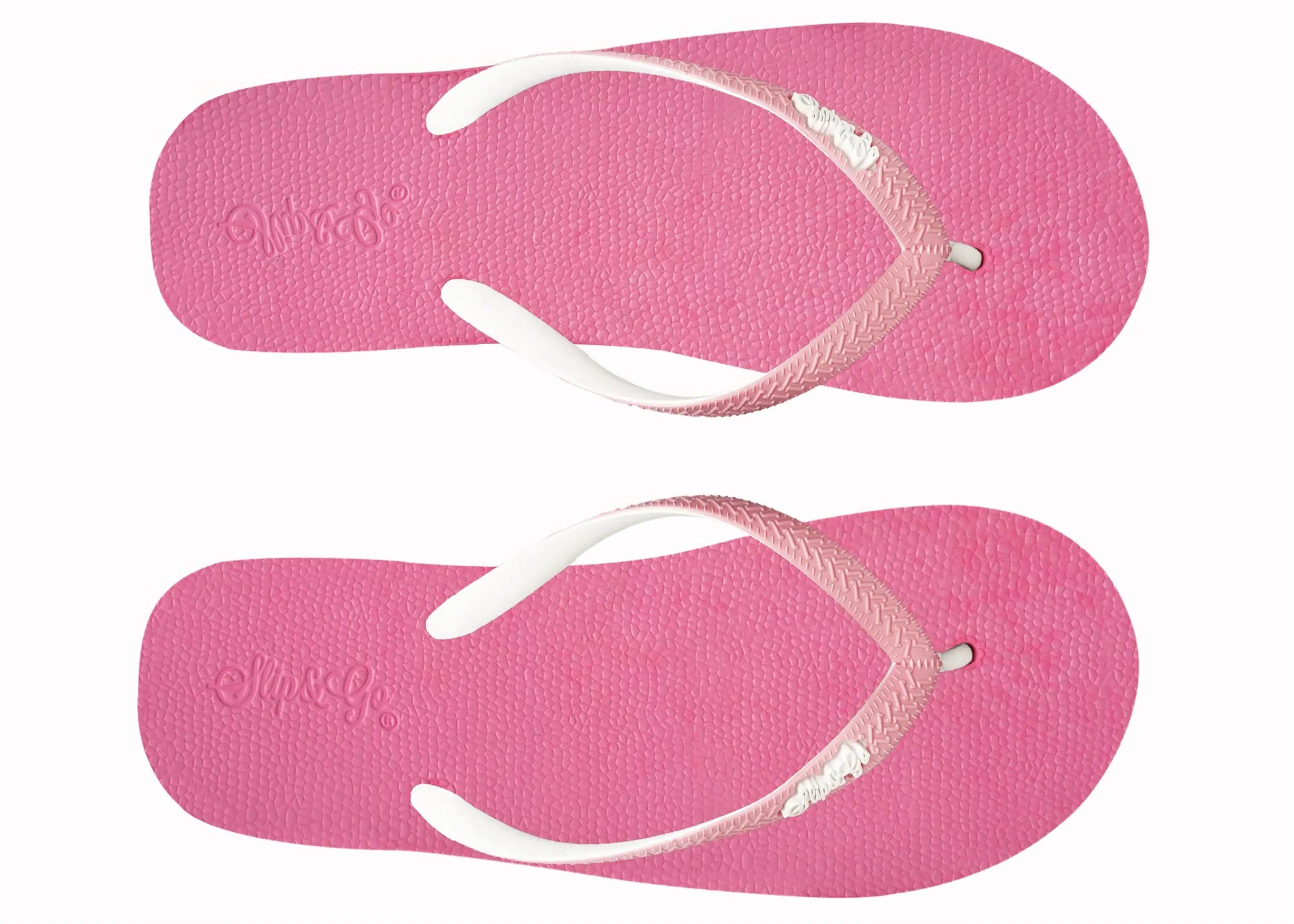 Pair of pink flip-flops with white straps on a white background