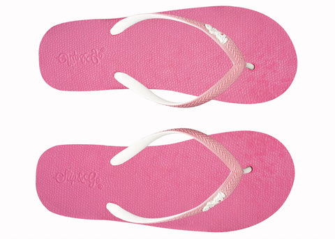 Pair of pink flip-flops with white straps on a white background