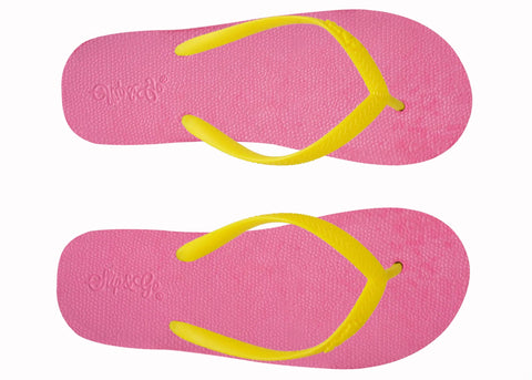 Pair of pink flip-flops with yellow straps on a white background