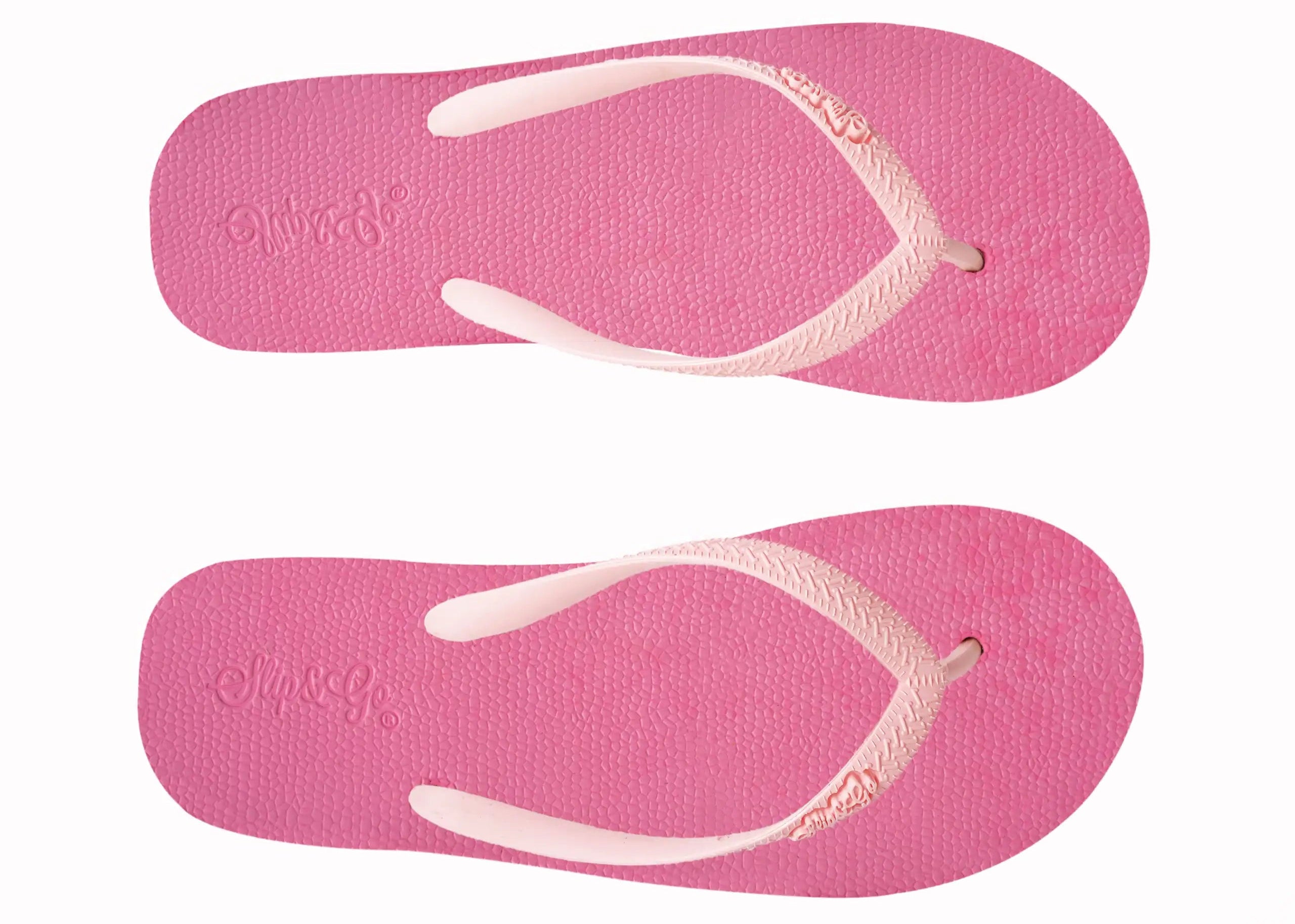 Pair of pink flip-flops with white straps on a white background