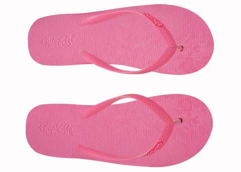 Pair of pink flip-flops on a white background