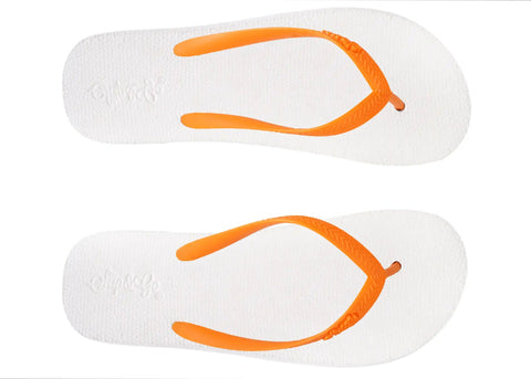White flip-flops with orange straps on a white background