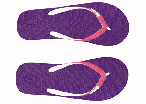Purple flip-flops with pink straps on a white background
