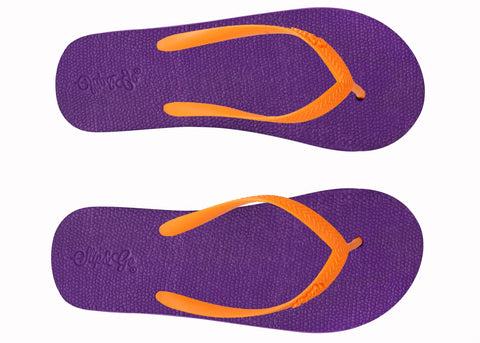 Purple flip-flops with orange straps on a white background