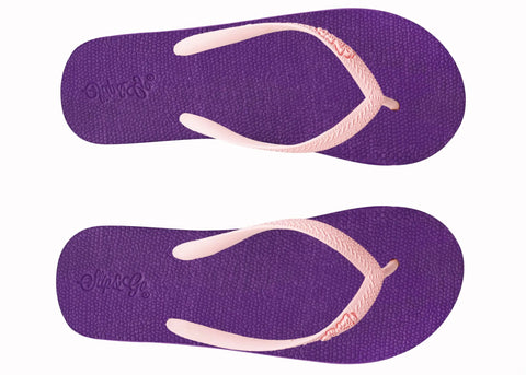 Purple flip-flops with pink straps on a white background