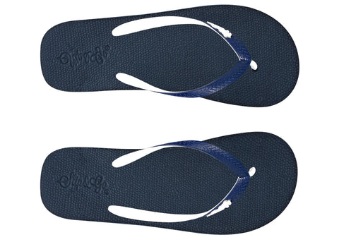 Pair of navy blue flip-flops with white straps on a white background