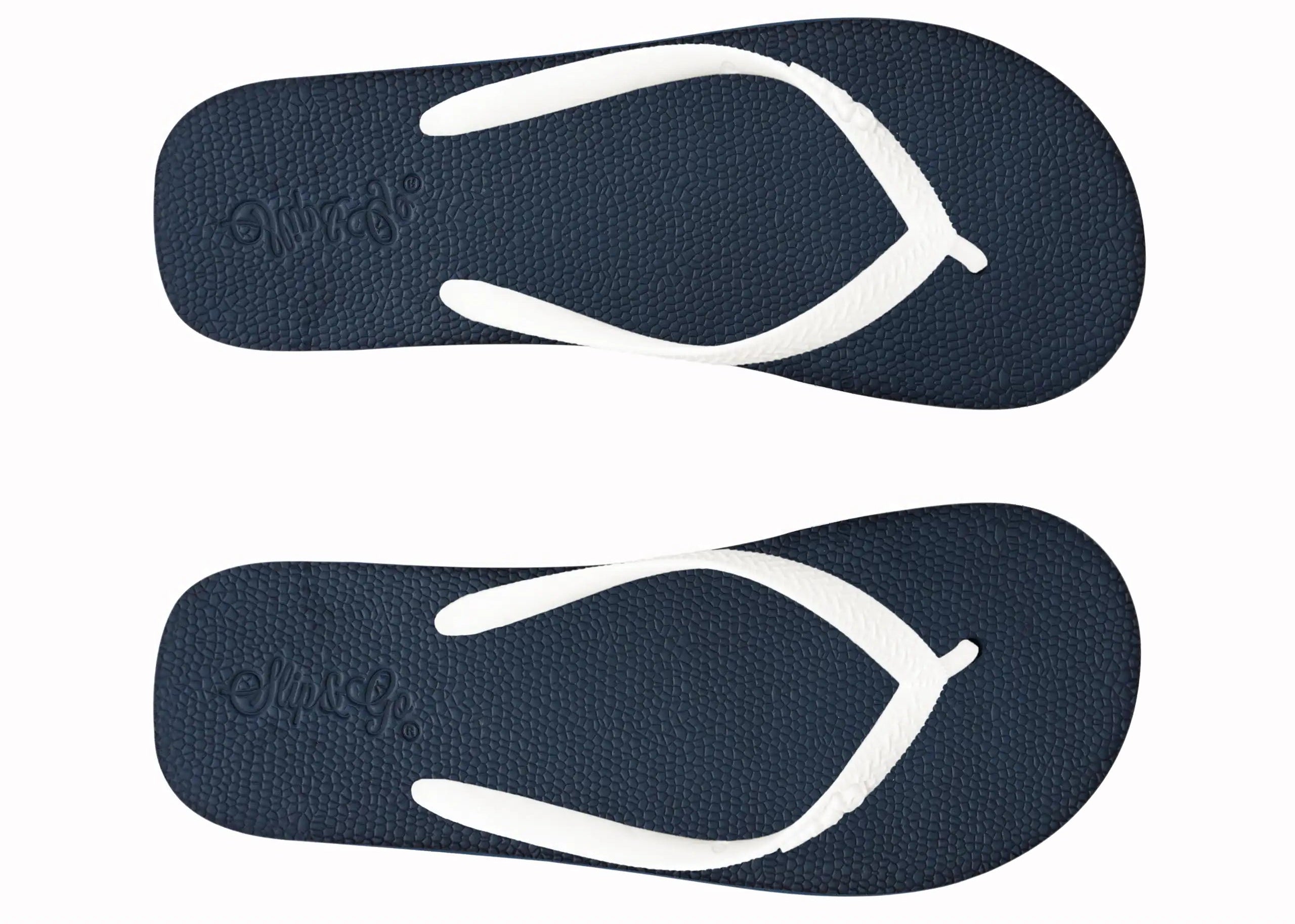 Pair of navy blue flip-flops with white straps on a white background