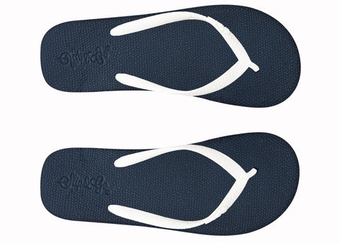 Pair of navy blue flip-flops with white straps on a white background
