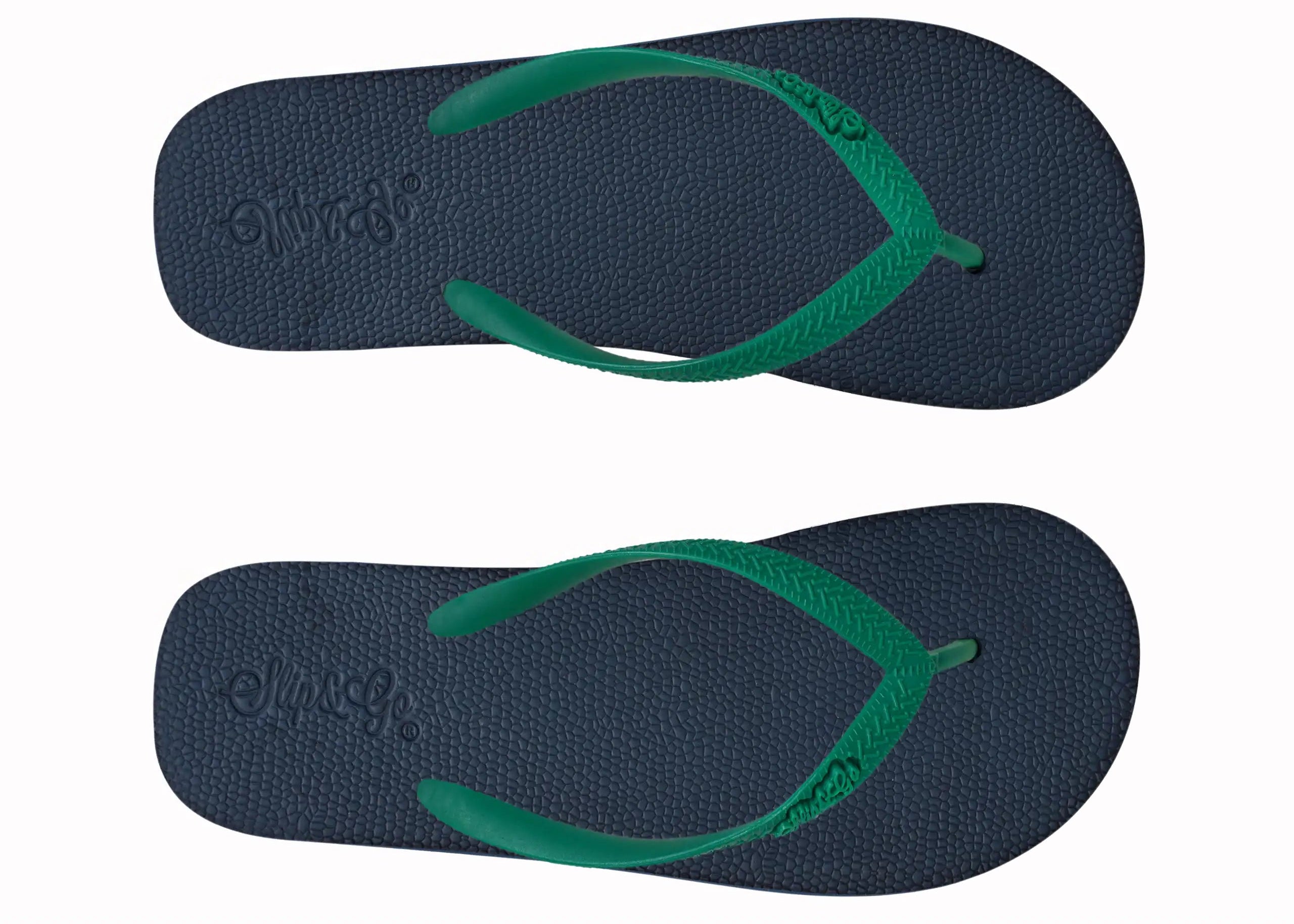 Pair of navy blue flip-flops with green straps on a white background