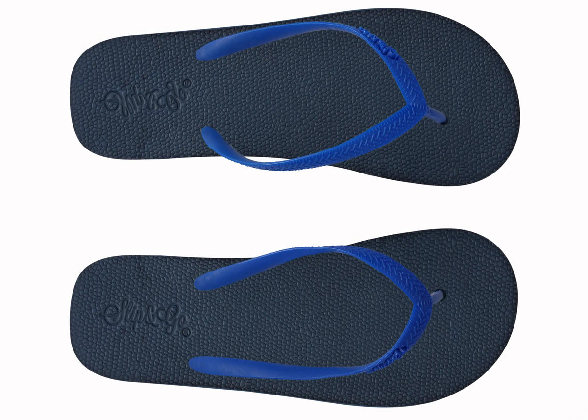 Pair of navy blue flip-flops with blue straps on a white background