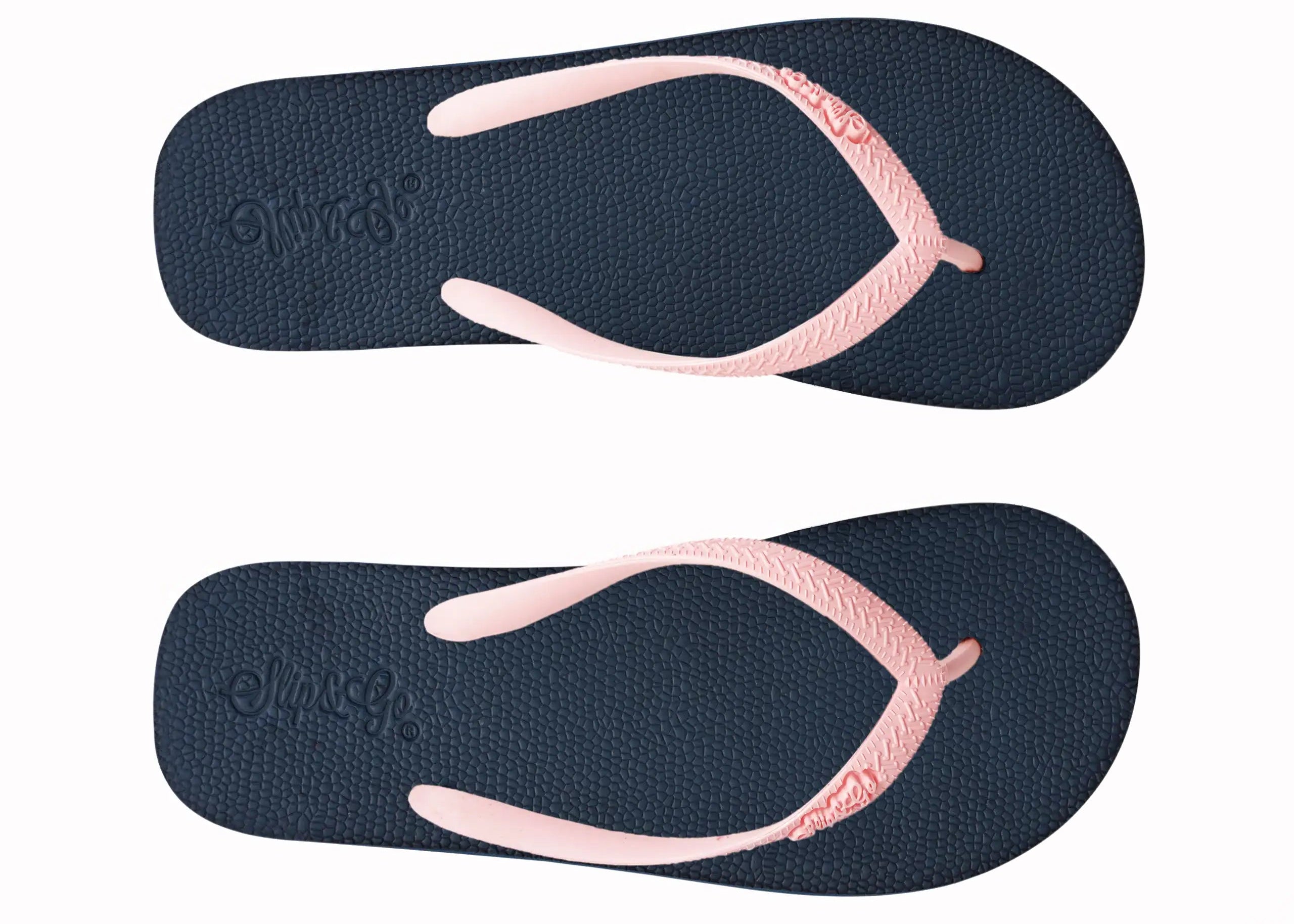 Pair of navy blue and pink flip-flops on a white background