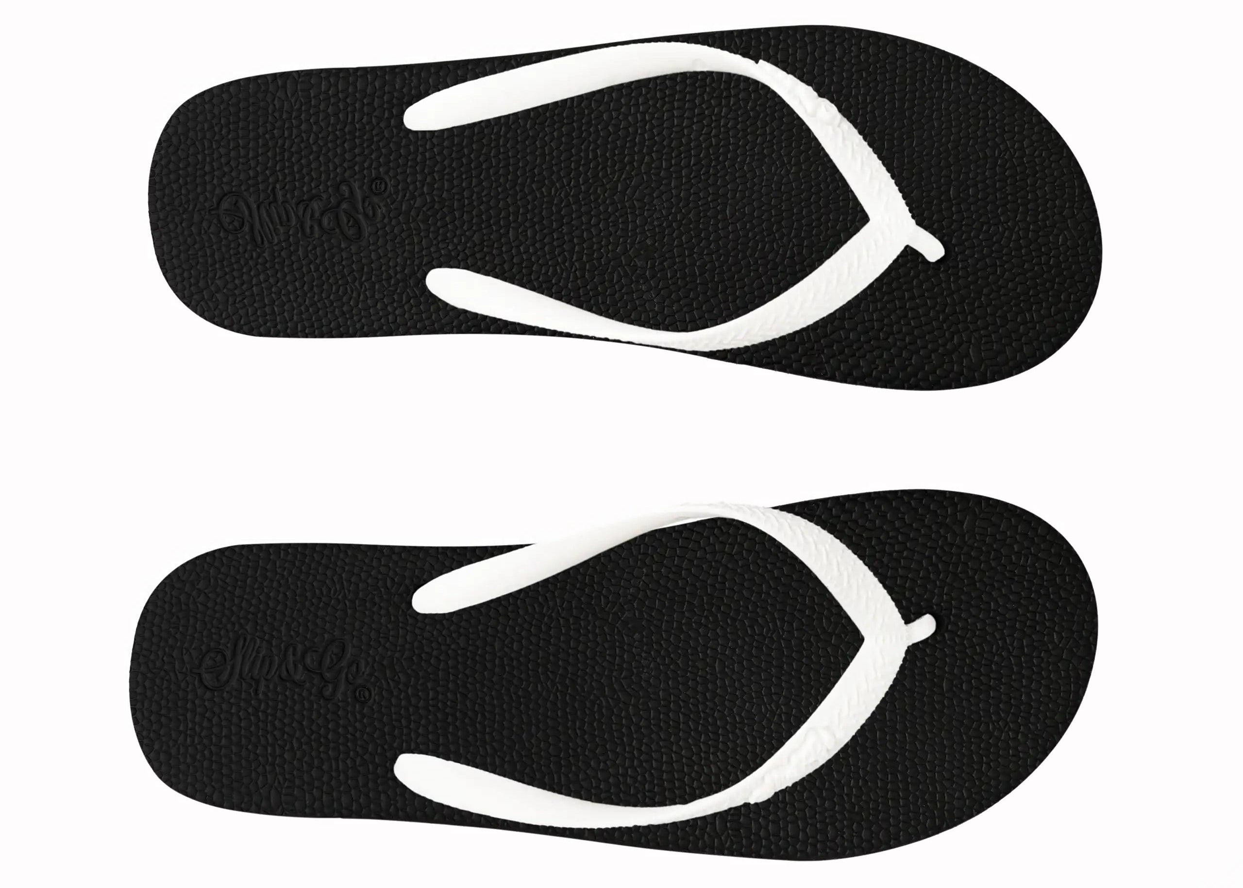 Black flip-flops with white straps on a white background