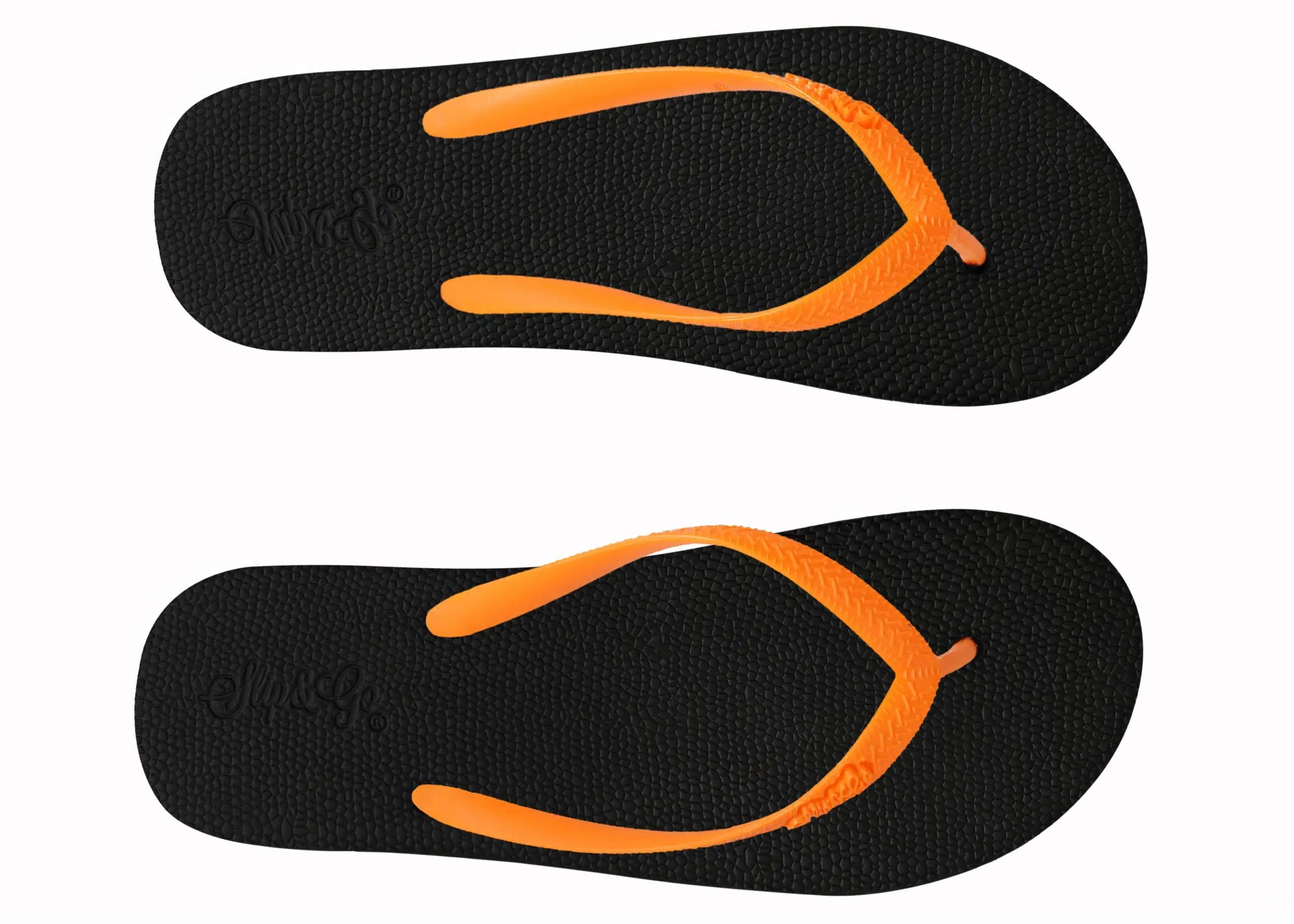 Black flip-flops with orange soles on a white background