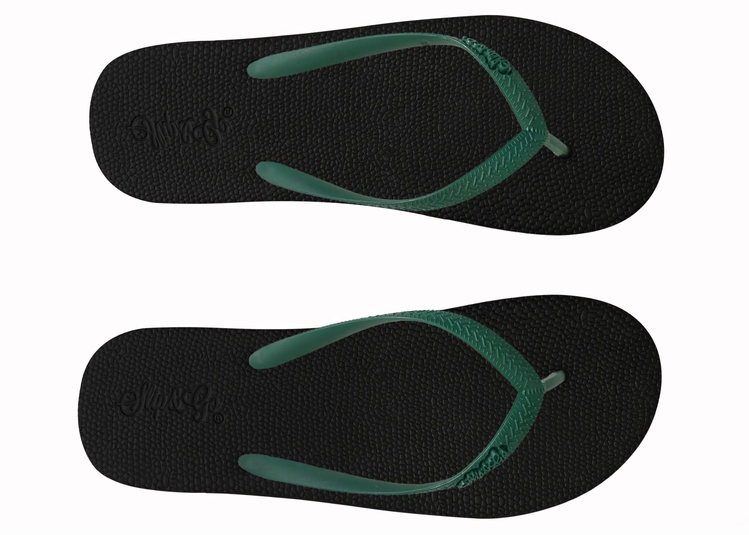 Black flip-flops with green straps on a white background
