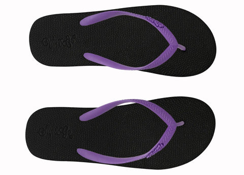 Black flip-flops with purple straps on a white background