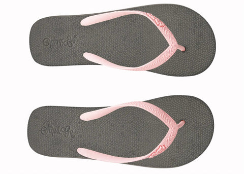 Pair of gray flip-flops with pink straps on a white background