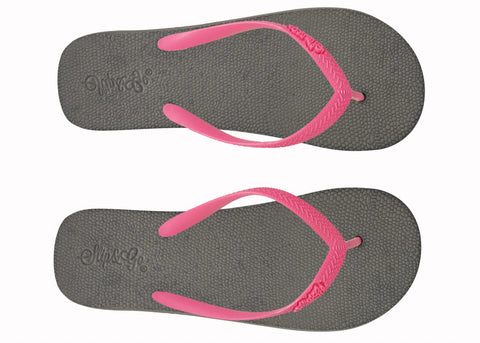 Pair of gray flip-flops with pink straps on a white background