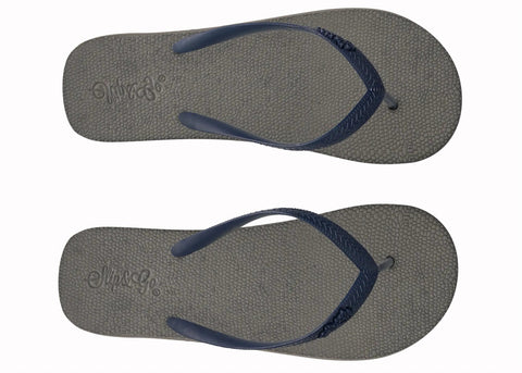 Pair of gray flip-flops with navy straps on a white background