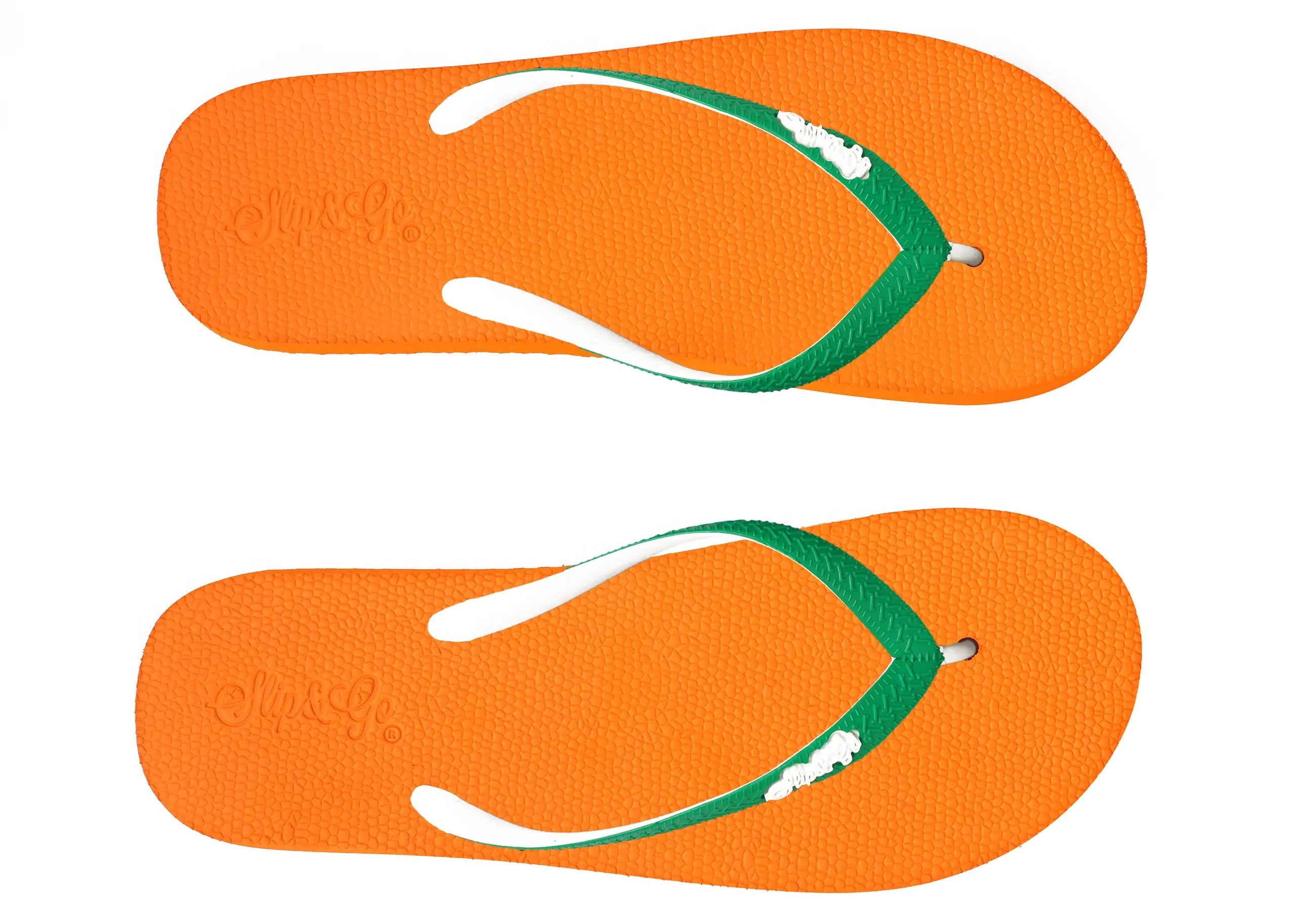 Orange flip-flops with green straps on a white background